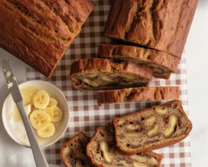 Moist banana zucchini bread loaf with ripe bananas and shredded zucchini.