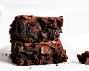 Deliciously fudgy zucchini brownies topped with chocolate frosting