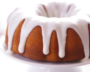 Delicious pumpkin spice cake with cream cheese frosting, perfect for fall desserts.