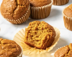Deliciously spiced and fluffy pumpkin muffins ready to enjoy this fall.