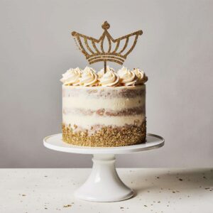 Gold glitter birthday cake with crown topper.