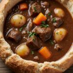 Bowl of Witch’s Cauldron Beef Stew with vegetables and herbs