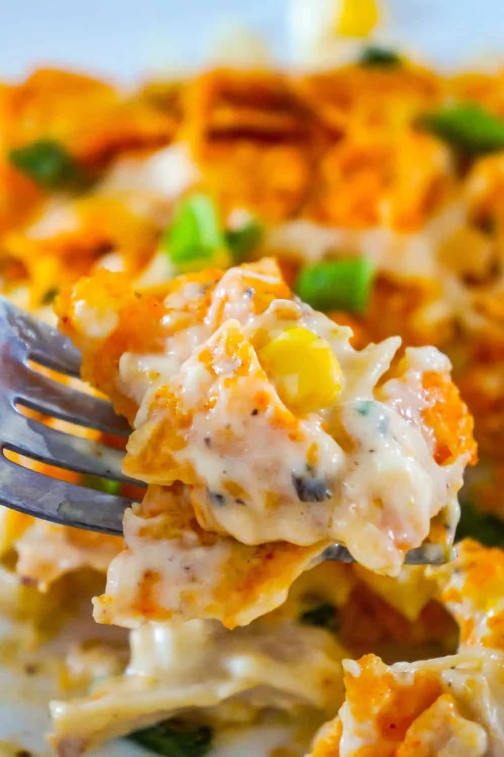 Delicious Doritos casserole with chicken topped with melted cheese