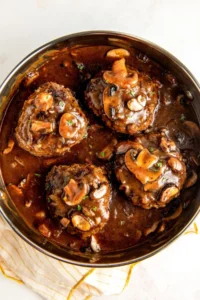 Delicious Salisbury Steak served with gravy and mashed potatoes