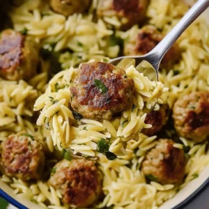 Delicious Greek chicken meatballs served with lemon orzo on a plate