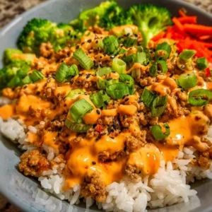 Ground turkey rice bowls topped with Bang Bang sauce for a flavorful meal.
