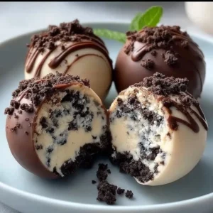 No-bake cookies and cream cheesecake balls served on a dessert plate