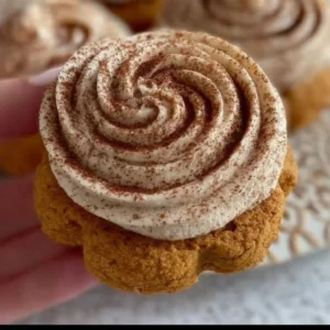 Soft pumpkin cookies with cinnamon frosting on a plate