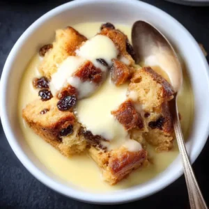 Delicious custard bread pudding served with a sprinkle of cinnamon