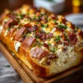 Delicious Chicken Bacon Ranch Stuffed Bread with melted cheese and crispy bacon