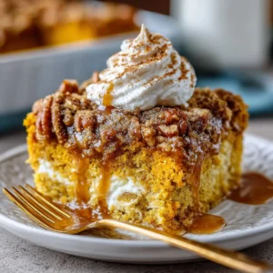 Delicious easy pumpkin dump cake topped with whipped cream
