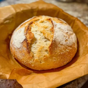 Loaf of easy sourdough discard bread on a wooden table