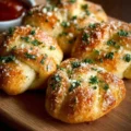 Delicious sourdough garlic knots fresh out of the oven, golden and fluffy.
