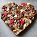 Delicious homemade Valentine Bark with chocolate and colorful toppings.