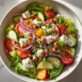 Colorful Easter Spring Salad with goat cheese and vibrant seasonal vegetables