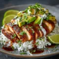 Honey lime chicken served with avocado rice stack on a plate