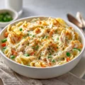 Simple chicken casserole in a baking dish with vegetables and golden topping