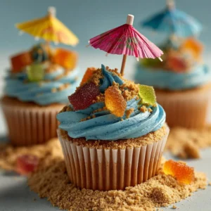 Fun and colorful beach cupcakes decorated with ocean-themed designs