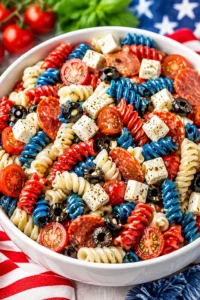 Delicious Red, White and Blue Pasta Salad with colorful ingredients for summer events.