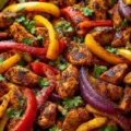 Delicious sheet pan chicken fajitas with colorful bell peppers and onions.